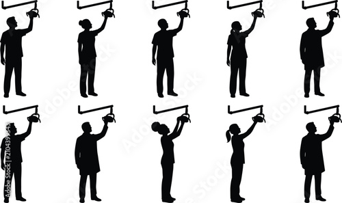 Foto Silhouettes of medical doctors adjusting surgical lights