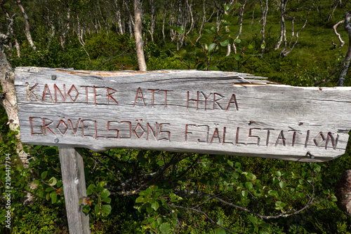 Canvas Print Grovelsjon, Sweden, A wooden sign on a beachfront says Canoes for rental at the shop, in Swedish