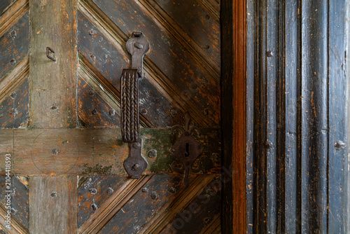 Canvastavla Sarna, Sweden Wooden door details in the  interior  of the landmark wooden Särna gammelkyrka or Sarna Old Church from 1697