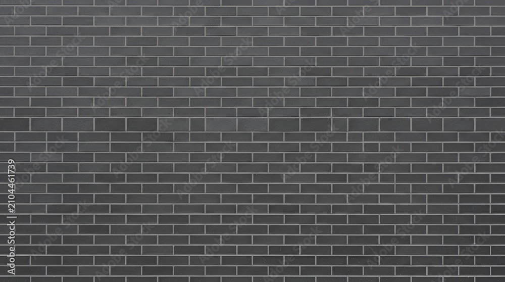 Fototapeta premium Seamless texture of a dark grey brick wall with clean lines and uniform rectangular bricks, architectural backgrounds or
