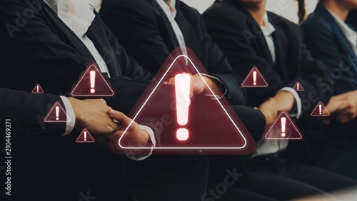 Bild auf Leinwand A corporate meeting scene showing participants in suits, highlighting caution through warning symbols