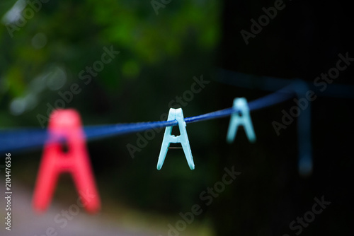 Clothespins on the clothesline closeup with selective focus