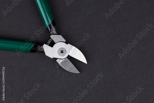 Canvastavla New side cutting pliers on dark background