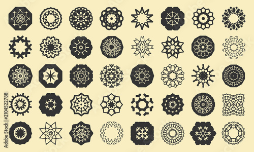 Forty monochrome openwork mandalas, snowflakes and decorative elements. Vector set