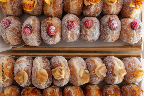 Obraz na plátne Delicious Assortment of Sweet Pastries on Display in a Bakery
