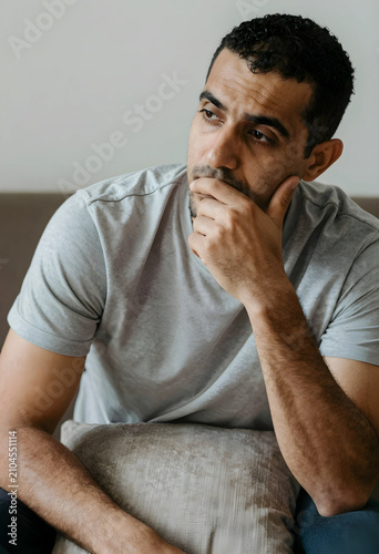 Thoughtful young man with a...