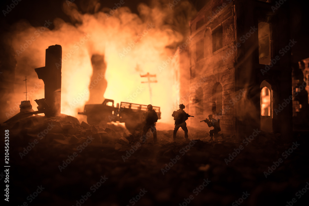 Fototapeta premium War Concept. Battle scene on war fog sky background, Fighting silhouettes Below Cloudy Skyline at night. City destroyed by war