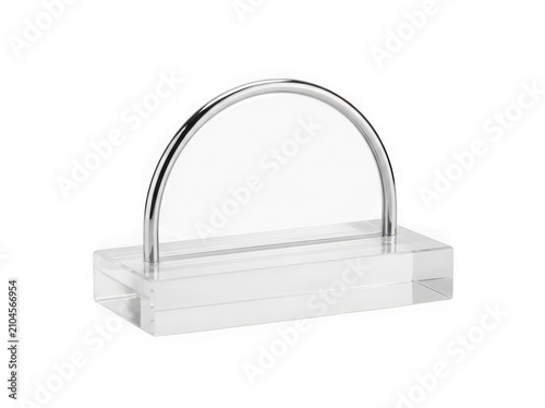 Modern metal handle on a rectangular glass base for display or serving