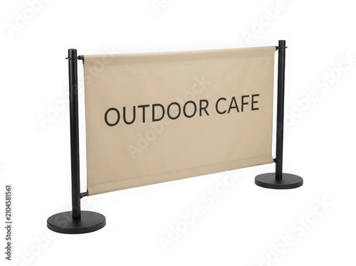 Outdoor cafe banner stand with black metal frame and beige fabric sign for restaurant seating area
