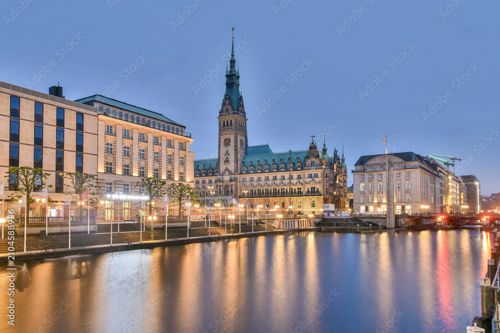 Fototapeta premium Rathaus in Hamburg, Germany, at dusk with reflections on Alster Canal