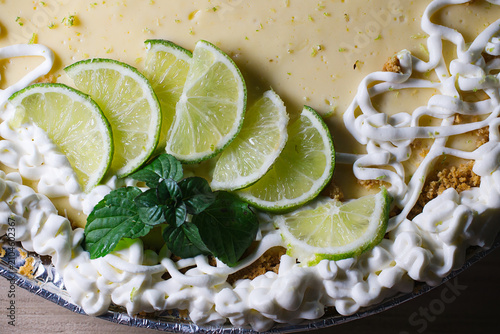 Key lime pie featuring fresh lime slices and mint