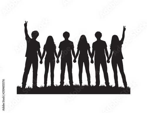Group silhouette of people holding hands with raised arms on grass