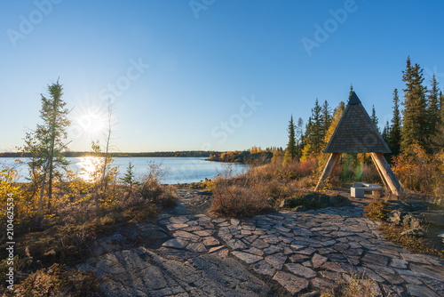 Frame Lake shore at sunset time, clear sky and sunlight. Yellowknife, Canada.