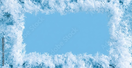 Frosted edges frame a clear sky blue expanse