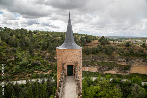 Historic castle overlooking serene river, perfect for adventure and exploration. High quality commercial imagery suitable for marketing, advertising, 