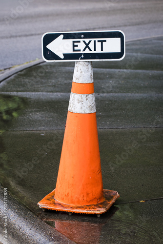 Exit Direction Sign Mounted on Orange Traffic Cone