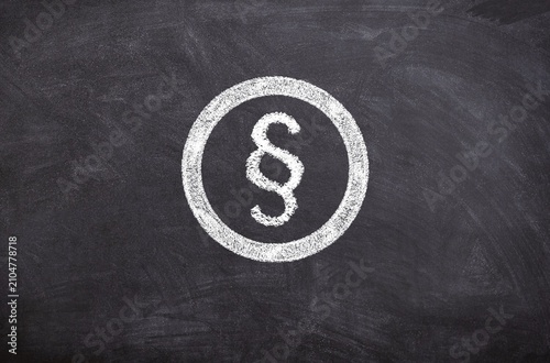 Hand-Drawn Chalk Sketch on Blackboard of Paragraph Symbol in Circle, Legal Illustration Concept