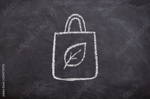 Bag with Plant Leaf Icon, Hand-Drawn Chalk Illustration on Blackboard, Minimal Digital Chalkboard Sketch, Eco-Friendly and Sustainability Concept Visualization