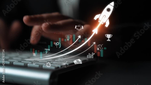 Modern Technology and Business Growth Concept with Digital Interface Showing Rocket Launch and Financial Charts on Laptop Keyboard Sigmoid