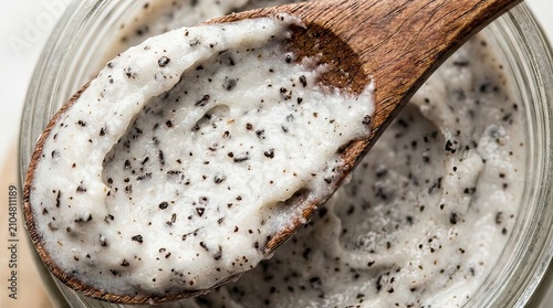 Creamy Chia Seed Pudding in Glass Jar with Wooden Spoon Closeup