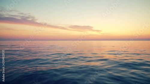Calm Ocean Water Under Sunset Sky