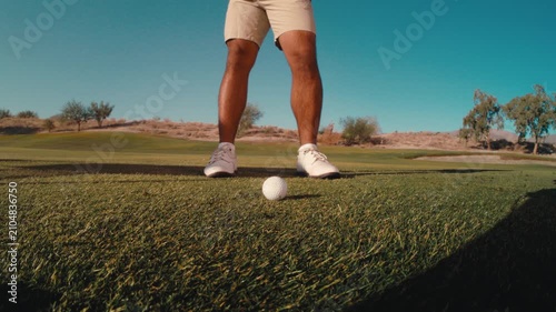 golfer hits ball and makes perfect divot in the fairway, scratch golfer close up wide angle push in extreme slow motion golf shot from the side with dirt flying on sunny day in 4k 800 fps