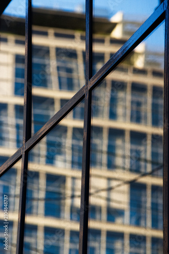 scaffolding reflected in industrial warehouse window