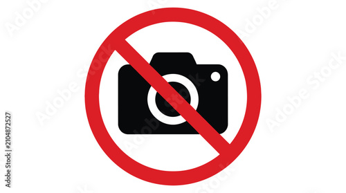A red circular no photography sign with a black camera icon crossed out inside it