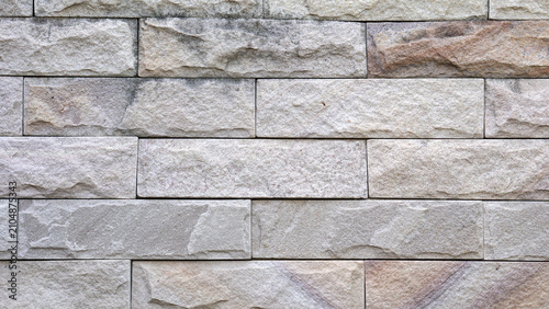 Natural Stone Brick Wall Texture Background with Stacked Rock Pattern