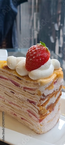 Mille Crepes is a delicate French inspired cake made from many thin crepes layered with light pastry cream. Soft and creamy with a melt in the mouth texture, this cake offers a refined, sweet