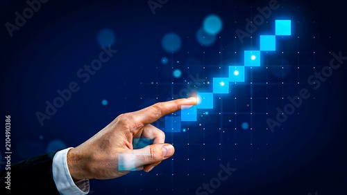 Business hand touching digital growth chart representing financial success and progress