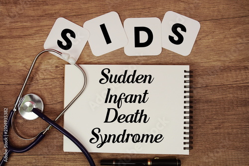 Tableau sur toile SIDS Sudden Infant Death Syndrome text written on notepad with stethoscope on wo