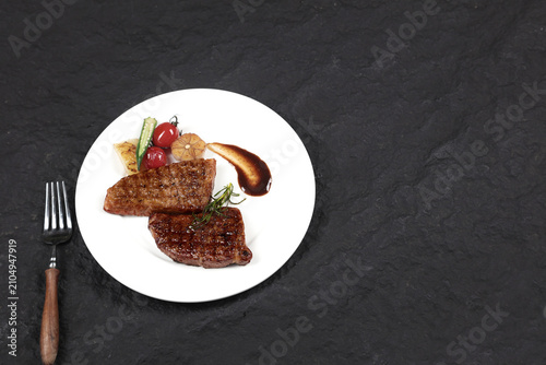 фотографія Grilled Steak Dinner with Roasted Vegetables on White Plate - Fine Dining Restau