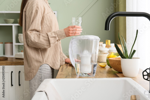 Woman holding a glass of fi...