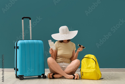 Woman in a wide-brimmed hat...