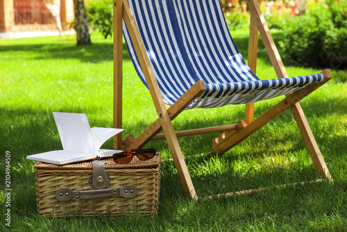 Striped wooden deck chair w...