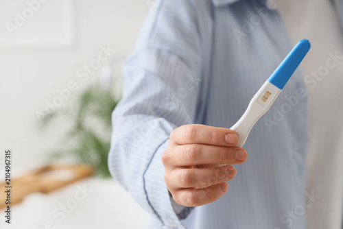 Woman with positive pregnan...