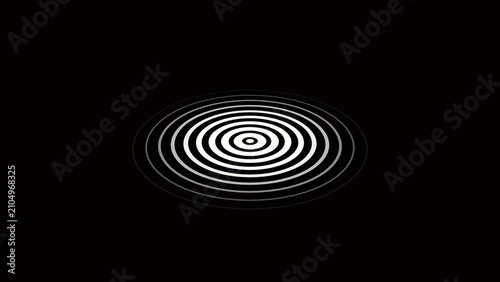 Фотография Concentric white and gray circles radiating outwards from a central point on a b