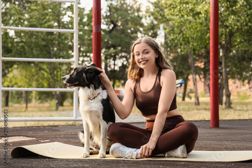 Sporty young woman with yog...