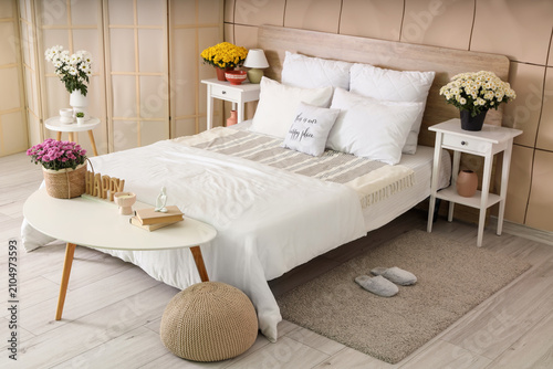 Interior of bedroom with ta...