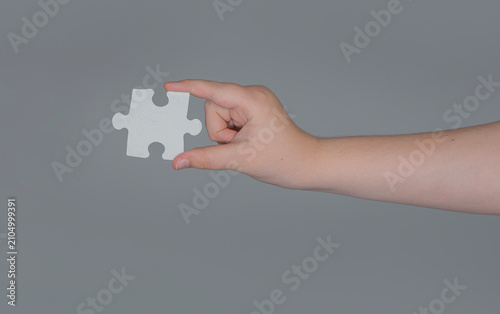 Фотография Problem solving uses white puzzle piece