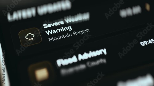 Latest updates feed with a severe weather warning and flood advisory in a government crisis center dashboard