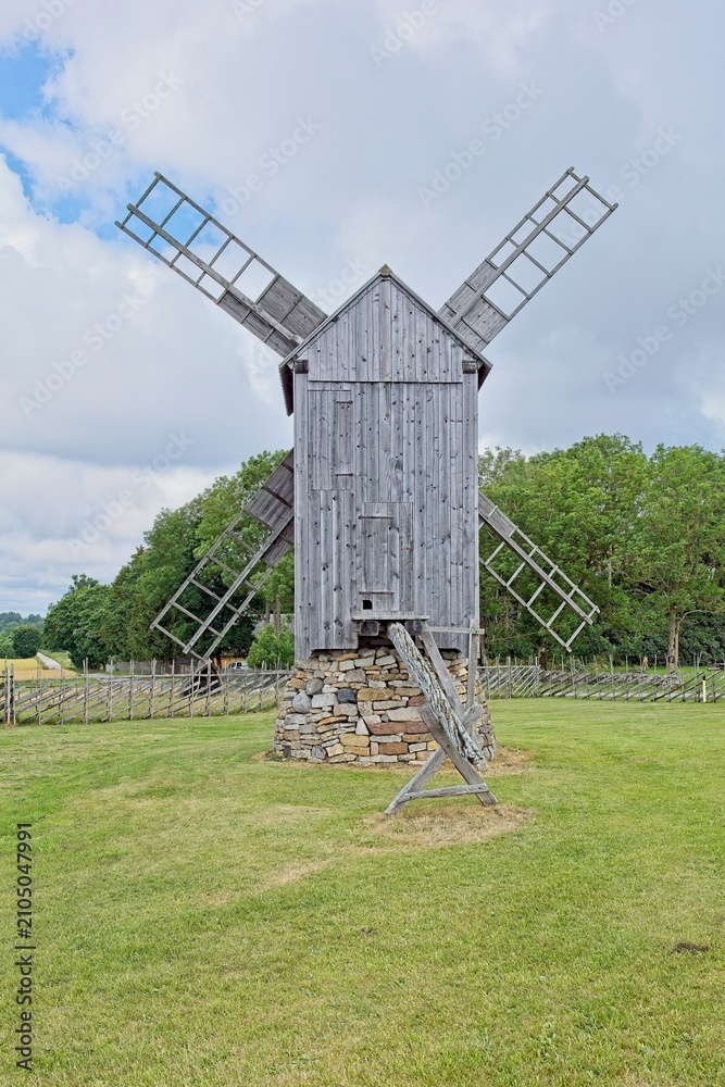 Obraz premium Historic wooden post mill (pukktuulik) located at Angla Windmill Park located on Saaremaa Island in Estonia, Europe.