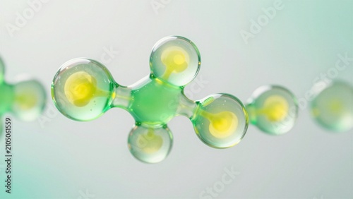 A close-up of a molecular structure composed of translucent green spheres connected by stems, featuring soft bokeh and vibrant yellow centers against a gradient background.