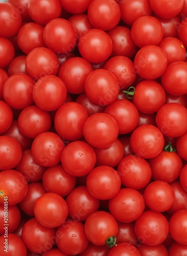 Fresh red cherry tomatoes background with vibrant round texture