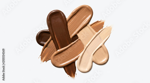 Professional makeup swatches blending light to dark foundation shades in heart shapes.