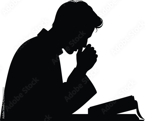 Obraz na płótnie Silhouette of man studying book or bible in prayerful pose with hand on chin for knowledge