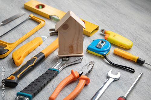 House model with a work tools on the table.