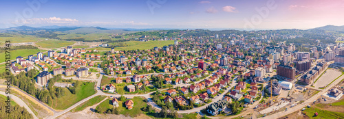 Фотография Zlatibor town showcasing numerous residences and modern buildings among green hi