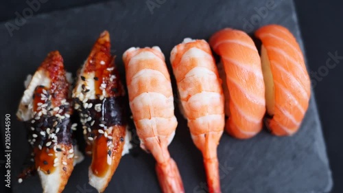 sushi on a black plate